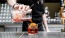 a person pouring a drink into a glass
